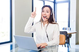 young pretty woman feeling like a happy and excited genius after realizing an idea. telemarketer concept