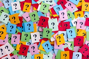 Multiple stick notes, all different colors, with question marks scribbled.