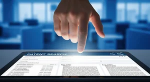 Hand interacting with patent search database on digital screen, legal research, blue corporate background, shallow depth.